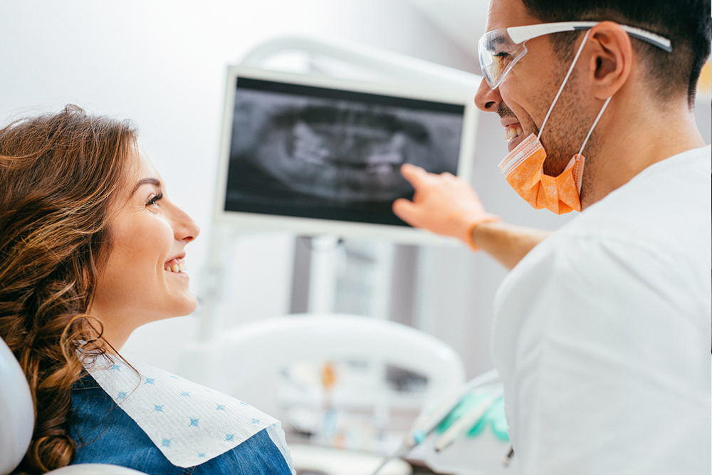 Patient discussing tooth pain with a dentist in Erin Ontario